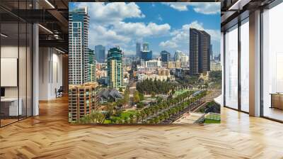 Aerial view of the city of San Deigo, CA downtown gaslamp district skyline filled with skyscrapers, hotels, business centers against a beautiful vivid cloud filled blue sky Wall mural