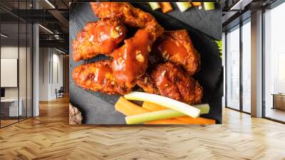 BBQ chicken wings on slate, dark table. View from above. Wall mural