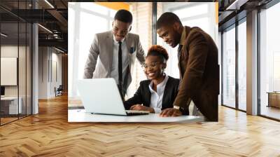 team of young african people in office at table with laptop  Wall mural