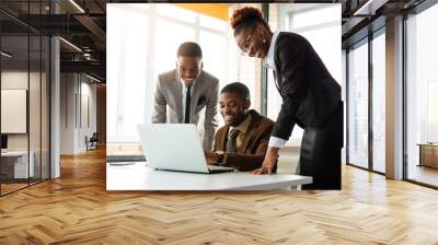 team of young african people in office at table with laptop  Wall mural