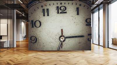 Vintage grunge background of an old clock. Abstract texture covered with dust, dirt, scratches. Macro photography in light tinted Wall mural