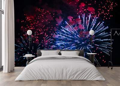 Inexpensive fireworks, over the city, white, red and blue . For any purpose. Wall mural