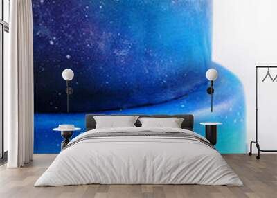 Artistic two-tiered cake with the image of the cosmos drawn by airbrush. Galaxy, stars in the night sky and silhouettes of trees. Cutout. Picture for a menu or a confectionery catalog. Close-up. Wall mural