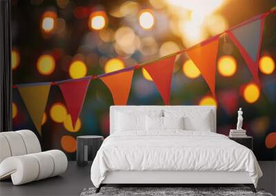 Colorful triangle flags are hanging at an outdoor summer party with string lights at sunset Wall mural