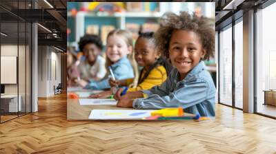 Happy african american schoolgirl is smiling while drawing with her classmates in kindergarten Wall mural