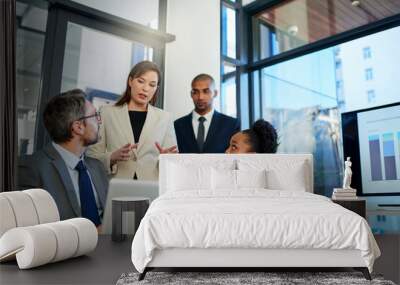 Getting the job done with teamwork. Cropped shot of a group of business colleagues meeting in the boardroom. Wall mural