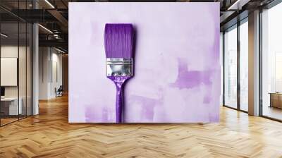 Paint brush dipped in purple paint, copy space, light background. Home repair concept. Wall mural