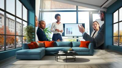 Sharing some of their big ideas. Cropped shot of a group of business colleagues meeting in the boardroom. Wall mural