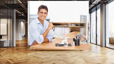 Web design, portrait or happy man with computer for IT support with technology for project or solution. Smile, business or proud employee programming with glasses or research online at desk in office Wall mural