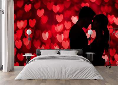 Silhouette of a couple with heart-shaped red bokeh background and copy space, Valentine's or Singles Day Wall mural