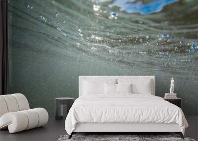 Sunlight and bubble under the water surface. Wall mural