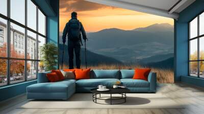 A person hiking in the mountains Wall mural