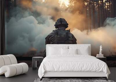 back view of a Military soldier smoke on ground in dark forest. Wall mural