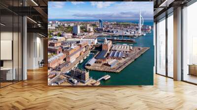 Aerial view of Portsmouth Historic Dockyard and the Royal Navy's ancient HMS Warrior warship as well as the Spinnaker Tower on the English Channel coast in the south of England, United Kingdom Wall mural