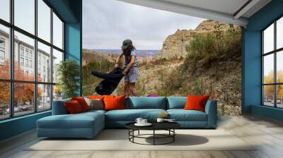 Young Indigenous Woman Shakes Her Vest During a Walk in the Mountains of Valle de Las Animas (Spirits' Valley) Wall mural