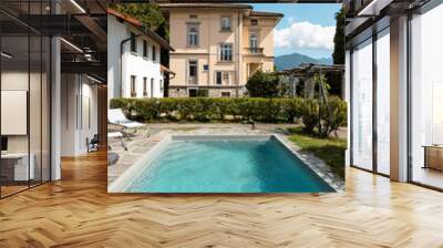 Ancient villa with swimming pool on a sunny summer day Wall mural