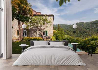 Beautiful Italian farmhouse in Tuscany surrounded by nature with a large garden Wall mural