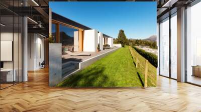 beautiful modern house in cement, view from the garden Wall mural