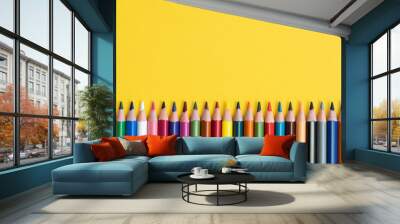 Coloring pencils isolated on yellow background close up concept with copy space for text  Wall mural