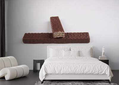 Two chocolate wafer biscuit on white background Wall mural