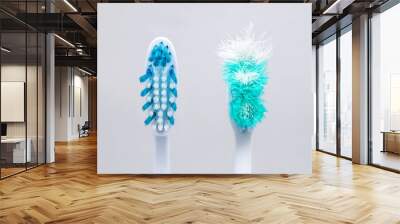 Image of used old and new toothbrushes isolated on a white background Wall mural