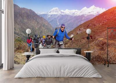 Group of Mountain Climbers walking up on Mountain Trail Sunny Wall mural