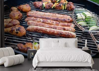 thuringian sausages, meat skevers and zucchini on a charcoal grill Wall mural