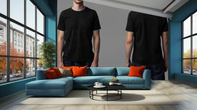 Young male in blank black t-shirt, front and back view. Design men t shirt template and mock-up for branding or print.  Wall mural