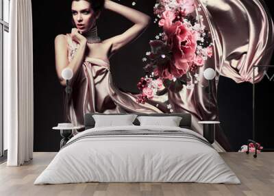 attractive woman in beautiful fabric and flowers Wall mural