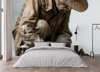 A detailed statue of an old man panning for gold, capturing historical gold rush era in a lifelike pose. Wall mural