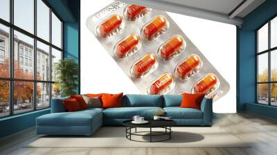 Blister pack with ten red capsules, isolated on white background. Medical and pharmaceutical concept image. Wall mural