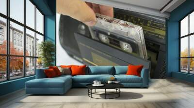 insert cassette into tape recorder Wall mural