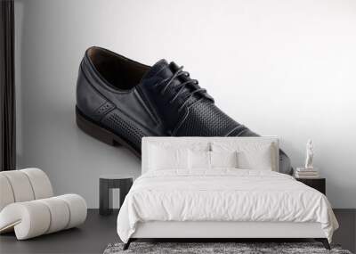 Black man leather shoe with shoelaces on white background Wall mural