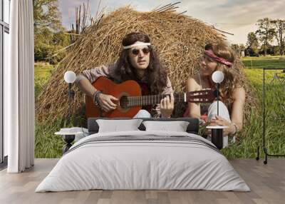 Hippie couple  playing guitar Wall mural