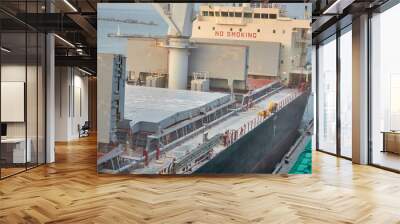 Port grain elevator. Industrial sea trading port bulk cargo zone grain terminal Wall mural