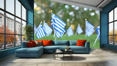 Flags of Greece in the grass. National holiday related 3D rendering Wall mural