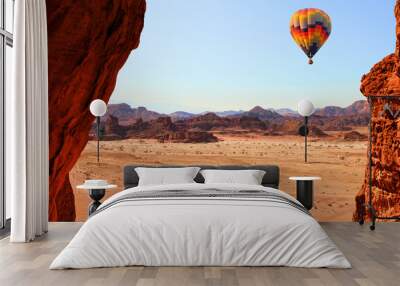 Colorful hot air balloon flight in the blue sky in beautiful landscape of multicolored stony desert with rocks. Timna geological park. Israel Wall mural