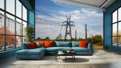 High-voltage transmission line and electric tower and power station chimneys on beauty sky background.  Wall mural