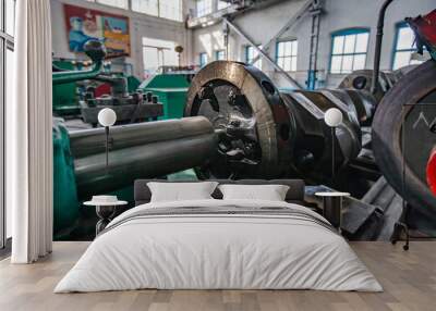 Kazaly, Kazakhstan - May 02, 2012: Restoring locomotive engine crankshaft on lathe closeup photo. Low depth of field. Wall mural