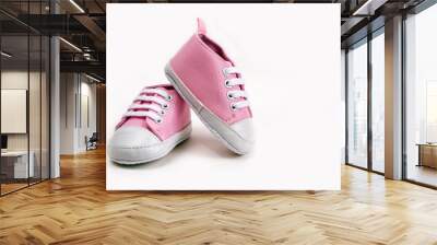 Pink baby girl shoes on a wooden floor outdoors Wall mural