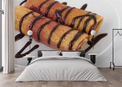 Two pancakes with cherry filling and chocolate sauce Wall mural