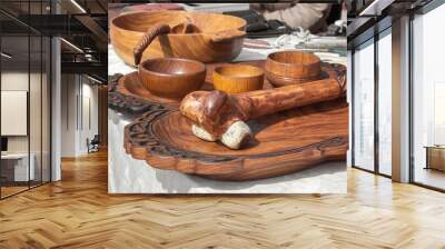 Traditional Kazakh wooden tableware with national ornament is sold on the street market. Wall mural