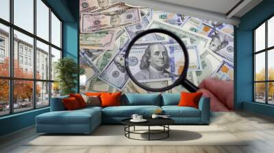 Magnifying glass on the background of bundle dollars - texture, background Wall mural