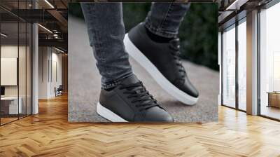 black with white classic sneakers gumshoes on the steps Wall mural