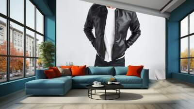 Man with hands in pockets wearing leather jacket Wall mural