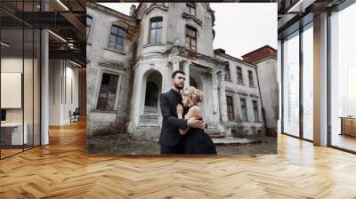 Portrait of a young couple in black suit and dress. Wedding Wall mural