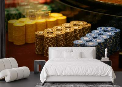 Gaming chips are on the card table. Smooth rows of playing chips in a casino. Wall mural