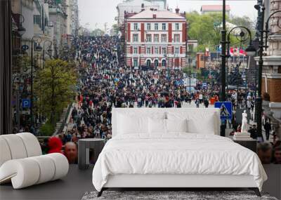 Residents of Vladivostok celebrate Victory Day. People walk along the blocked central street of the city - Svetlanskaya. Wall mural