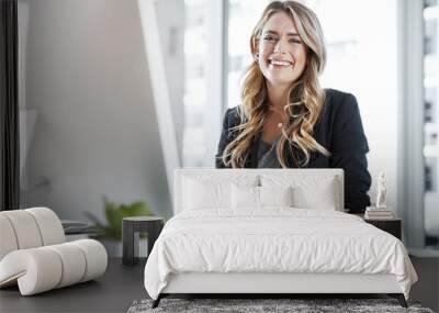 another day, another success. portrait of a young businesswoman working at her desk in a modern offi Wall mural