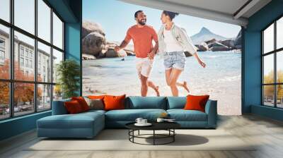 Black couple, beach and running while happy on vacation in summer with energy, love and happiness while outdoor. Man and woman together by the sea for honeymoon, holiday and quality time in nature Wall mural